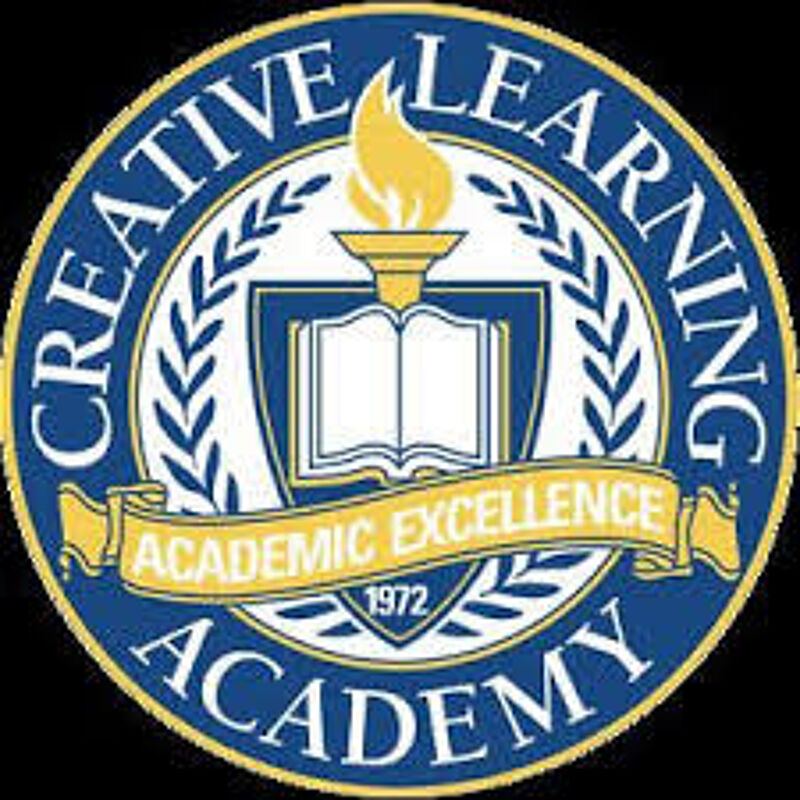 The image is a logo for Creative Learning Academy. It features a blue and gold circular design with the words "CREATIVE LEARNING ACADEMY" around the edge. In the center, there's an open book on a shield, topped with a flame. A banner reads "ACADEMIC EXCELLENCE 1972" across the shield. The logo also includes laurel branches.